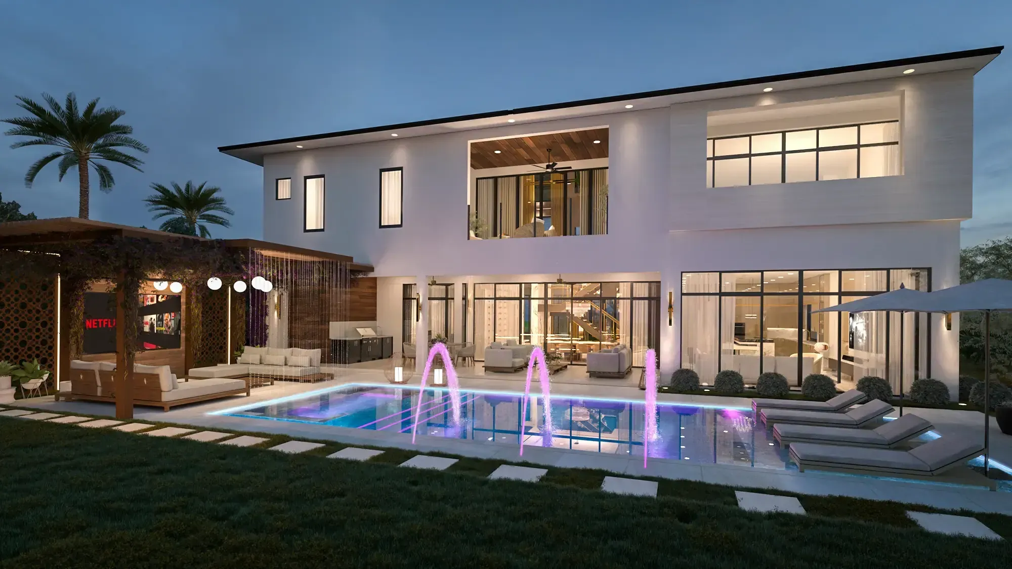 Rear elevation of the Balla Residence in Doral, Florida, at dusk, with a lit pool, fountain jets and a two-storey glass facade
