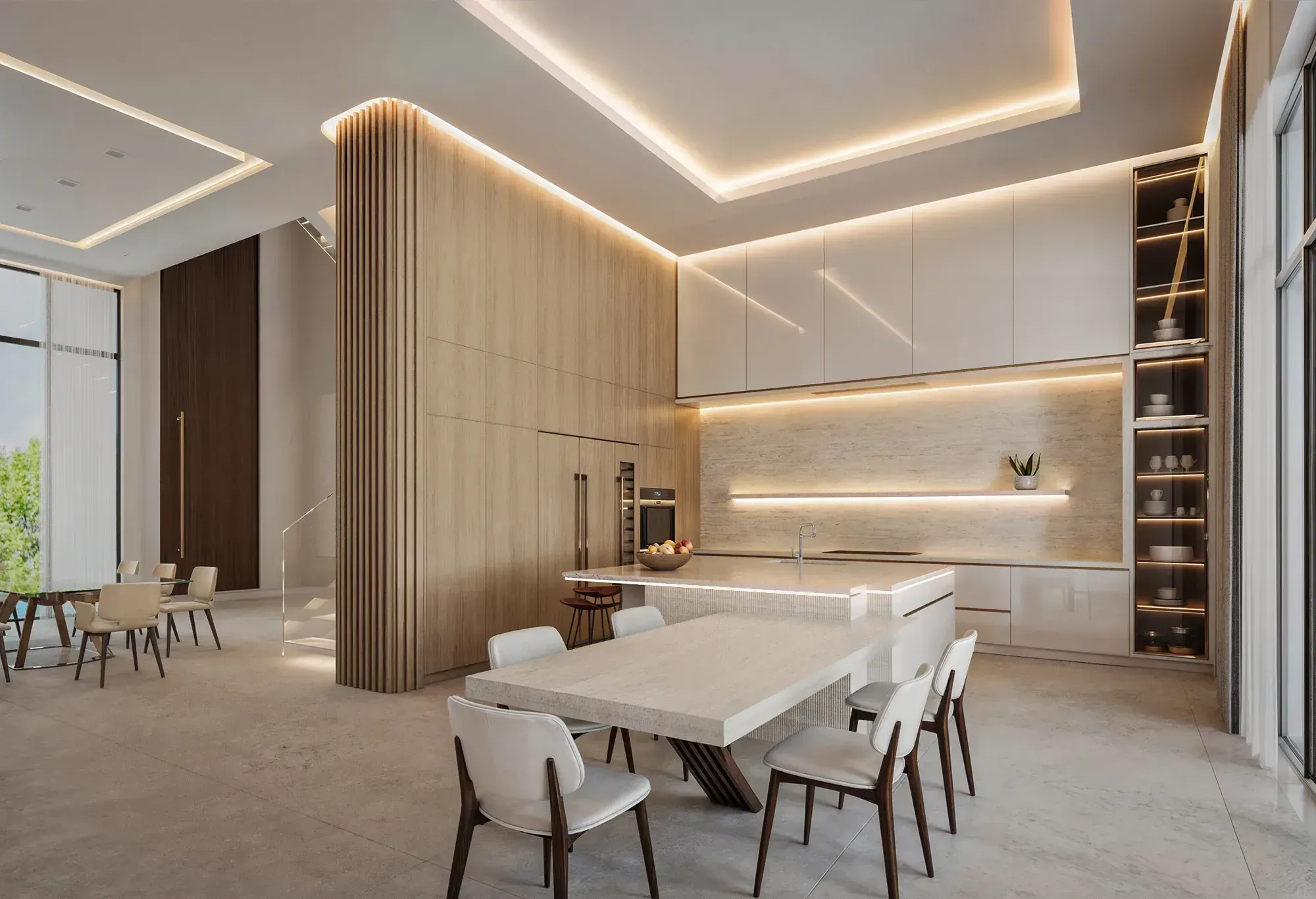 Kitchen and dining area at the Nusbaum Residence in Davie, Florida, with pale wood cabinetry, a stone island and integrated lighting