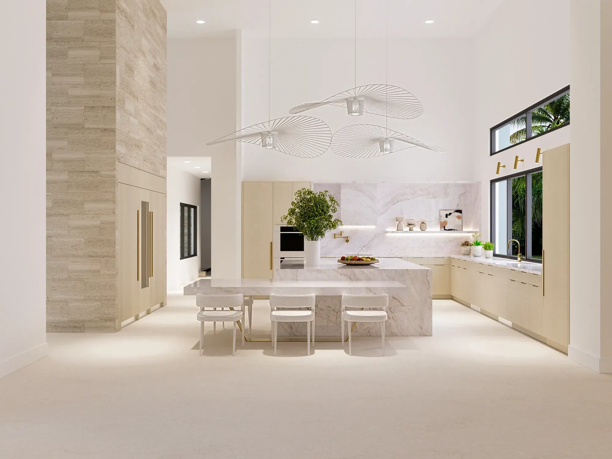 Kitchen at the Santander Residence in Southwest Ranches, Florida, with a stone-clad column, sculptural pendant and pale stone island